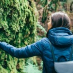 CDP is committed to maintaining environmental standards throughout our digital printing services, leading to people like this woman walking through green forests.