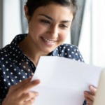 Happy employee receiving her mail via EasyPost Hybrid Mail