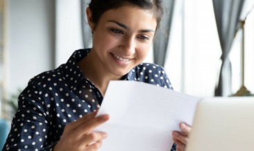 Happy employee receiving her mail via EasyPost Hybrid Mail