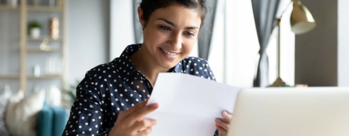 Happy employee receiving her mail via EasyPost Hybrid Mail