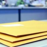 Stack of envelopes ready for transactional mail delivery