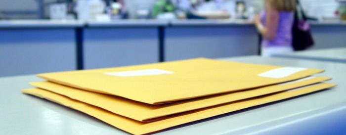 Stack of envelopes ready for transactional mail delivery