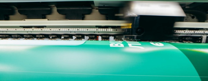 Large-format signage being printed on industrial printer