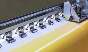 Large format printed display installed in a busy commercial environment